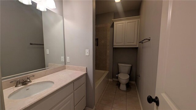 unfurnished bedroom with light carpet, a spacious closet, and baseboards