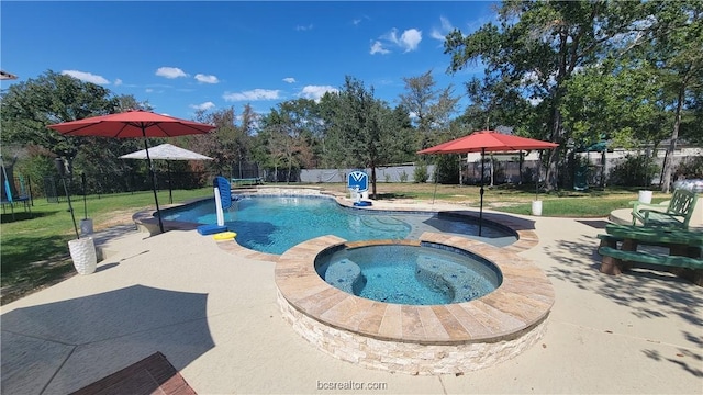 view of swimming pool featuring an in ground hot tub, a patio, and a lawn