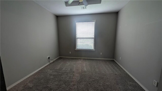 spare room with wood finished floors, a chandelier, crown molding, baseboards, and a tray ceiling
