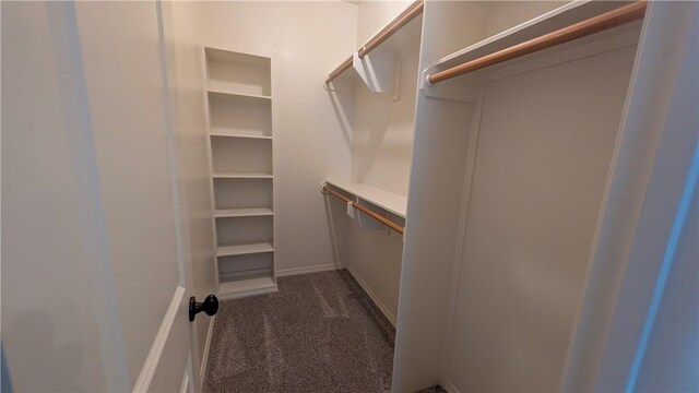 bathroom featuring toilet, vanity, and baseboards