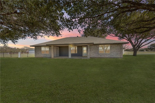 1796 Fawn Lake Dr, Bryan, TX 77808 - back of property at dusk featuring brick siding