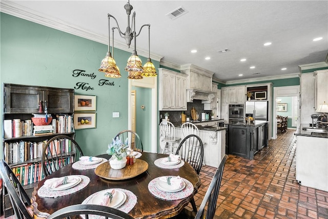 17265 Fm 2154th Rd, College Station, TX 77845 - dining area featuring brick floors, ornamental molding, and recessed lighting