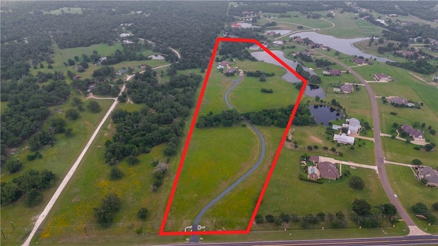 17265 Fm 2154th Rd, College Station, TX 77845 - aerial view of property and surrounding area featuring a large body of water and property parcel outlined