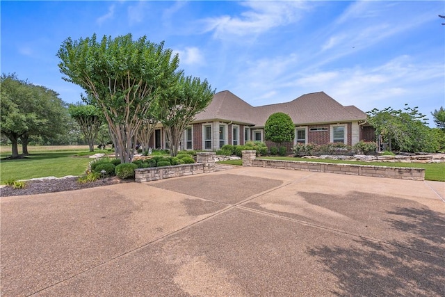 17265 Fm 2154th Rd, College Station, TX 77845 - view of front of property featuring brick siding and a front yard