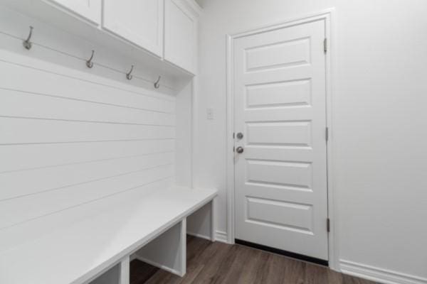mudroom with dark wood finished floors