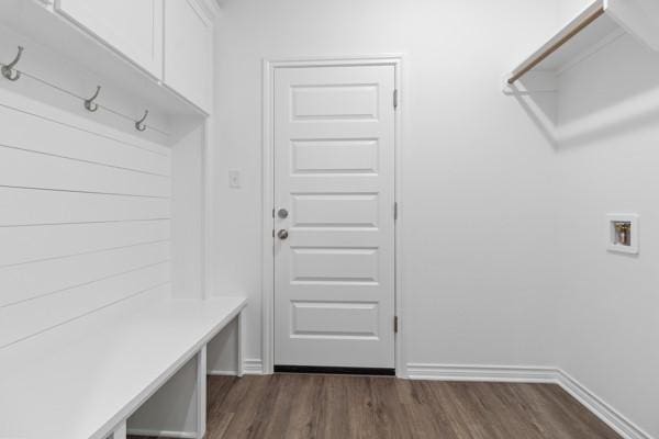 mudroom featuring baseboards and dark wood finished floors