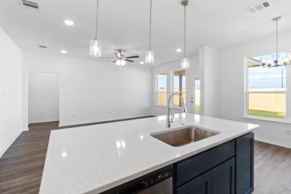 kitchen with visible vents, a sink, dark wood-style flooring, and open floor plan