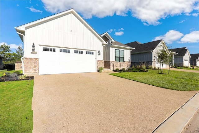 view of front of property with a front yard and a garage