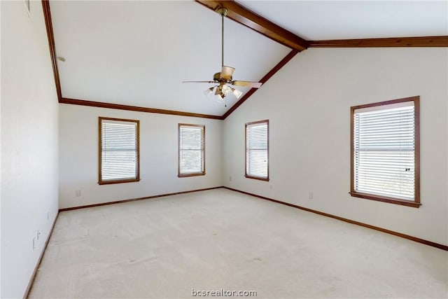 empty room featuring ceiling fan, beamed ceiling, light colored carpet, and high vaulted ceiling