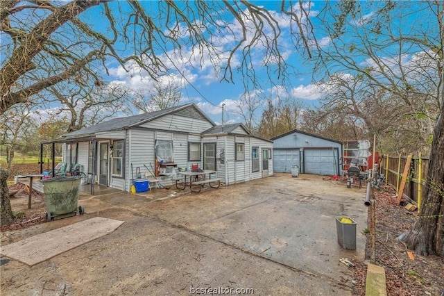 exterior space with an outbuilding and a garage