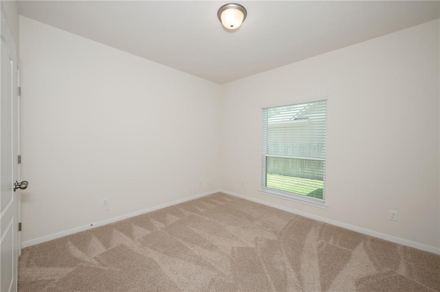 unfurnished room featuring carpet floors