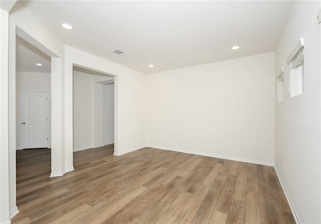 spare room featuring hardwood / wood-style floors