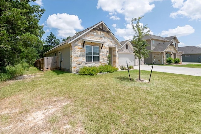 view of front of home with a garage and a front yard