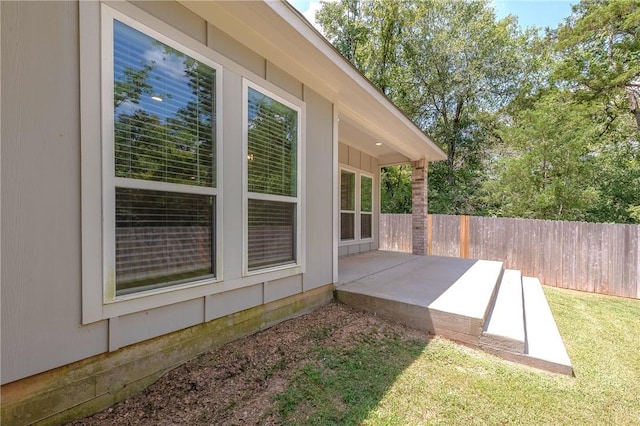 exterior space with a patio area and a yard