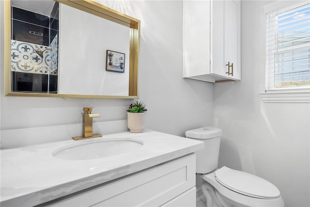 bathroom with vanity and toilet