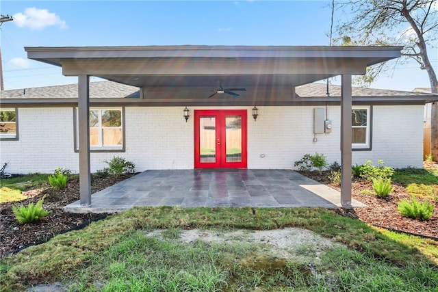 entrance to property featuring a patio area, ceiling fan, and french doors