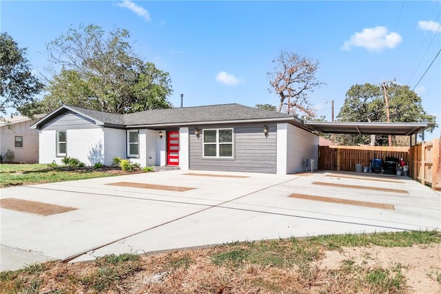 ranch-style house with a carport