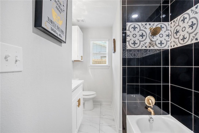 full bathroom with vanity, toilet, and tiled shower / bath