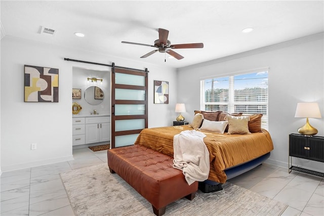 bedroom with ceiling fan, a barn door, ornamental molding, and ensuite bathroom