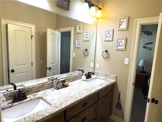 7585 Field Creek Estates Dr, Bryan, TX 77808 - bathroom with double vanity and baseboards