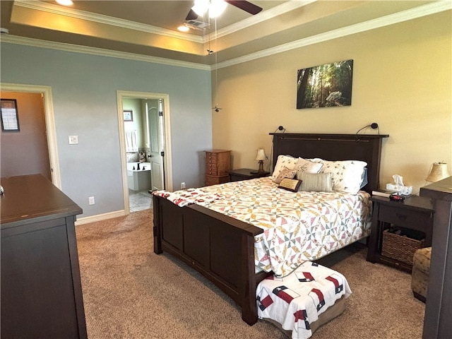 7585 Field Creek Estates Dr, Bryan, TX 77808 - carpeted bedroom with a tray ceiling, ornamental molding, ensuite bathroom, ceiling fan, and baseboards