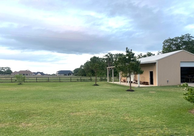 7585 Field Creek Estates Dr, Bryan, TX 77808 - view of yard with a garage and an outbuilding