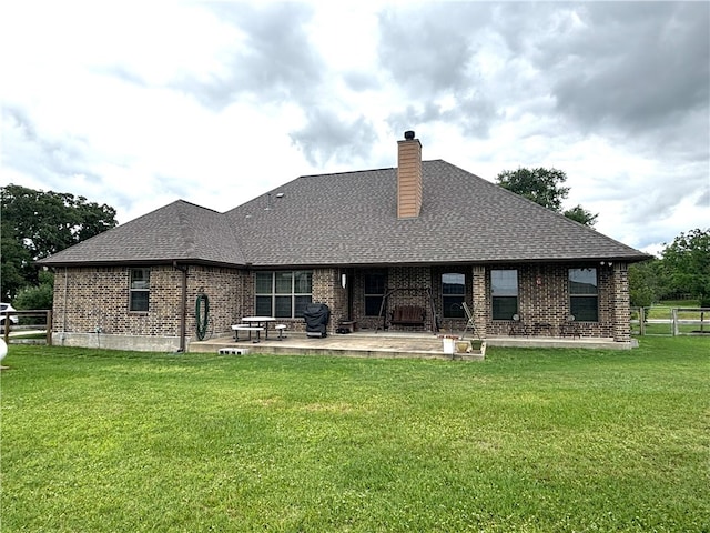 7585 Field Creek Estates Dr, Bryan, TX 77808 - back of property featuring brick siding, a patio, a chimney, and a shingled roof