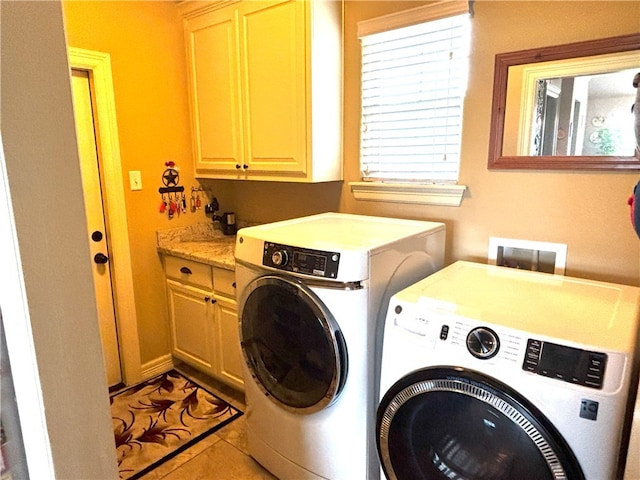 7585 Field Creek Estates Dr, Bryan, TX 77808 - laundry area with washing machine and clothes dryer, cabinet space, and tile patterned floors