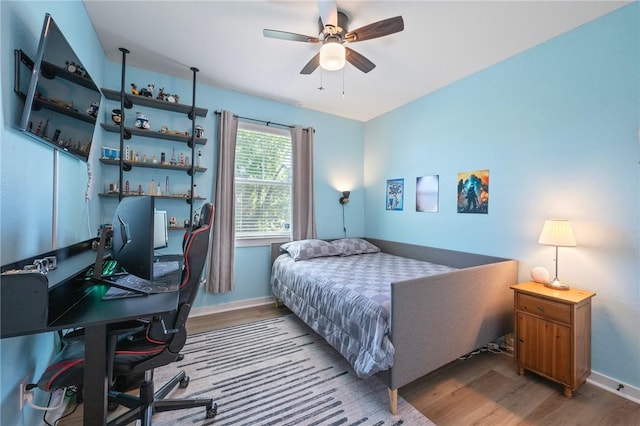 3914 Alamosa St, College Station, TX 77845 - bedroom with wood finished floors, an office area, baseboards, and ceiling fan