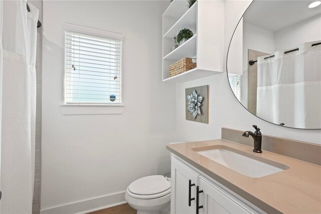 3914 Alamosa St, College Station, TX 77845 - full bath featuring vanity, toilet, baseboards, and curtained shower