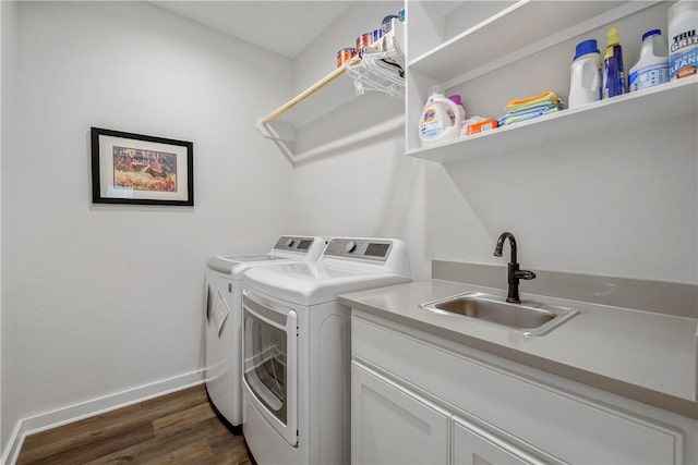 1749 Dakota Ln, College Station, TX 77845 - washroom with cabinet space, washing machine and clothes dryer, dark wood finished floors, and baseboards