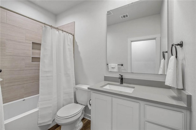 1749 Dakota Ln, College Station, TX 77845 - full bath featuring vanity, toilet, shower / bath combo, and wood finished floors