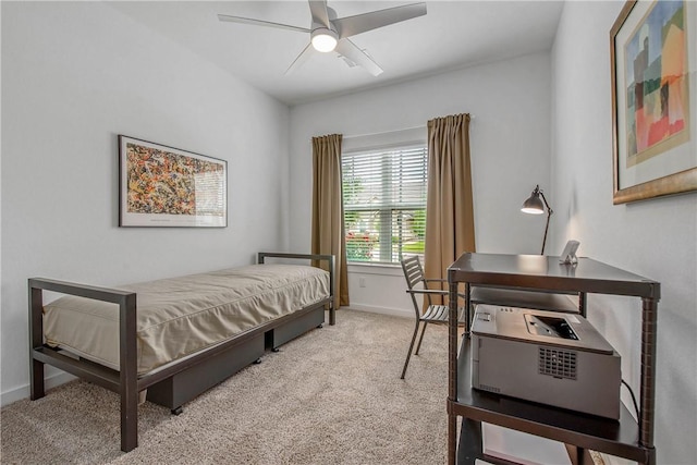 1749 Dakota Ln, College Station, TX 77845 - bedroom featuring light colored carpet, baseboards, a desk, and a ceiling fan