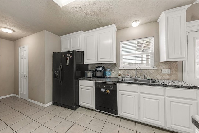 kitchen featuring backsplash, white cabinetry, sink, and black appliances