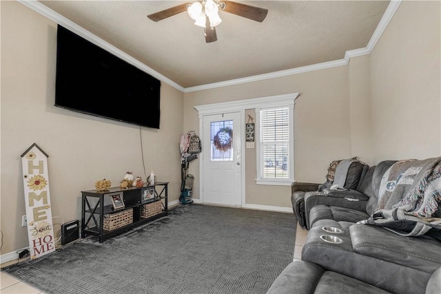 living room featuring tile patterned floors, ceiling fan, and ornamental molding