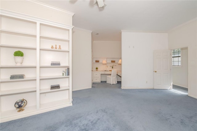 interior space featuring built in desk and crown molding