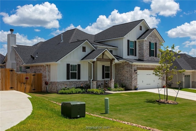 view of front of home with a front lawn and a garage