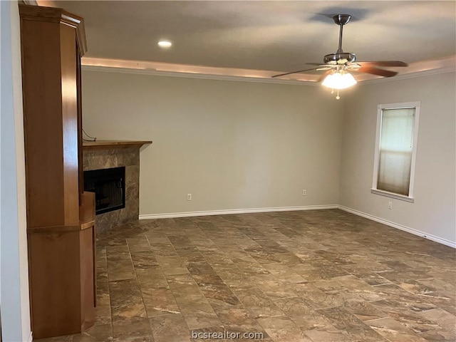 unfurnished living room with a fireplace, ceiling fan, and crown molding