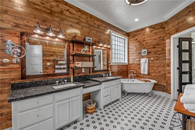 full bath with wooden walls, a soaking tub, ornamental molding, and vanity