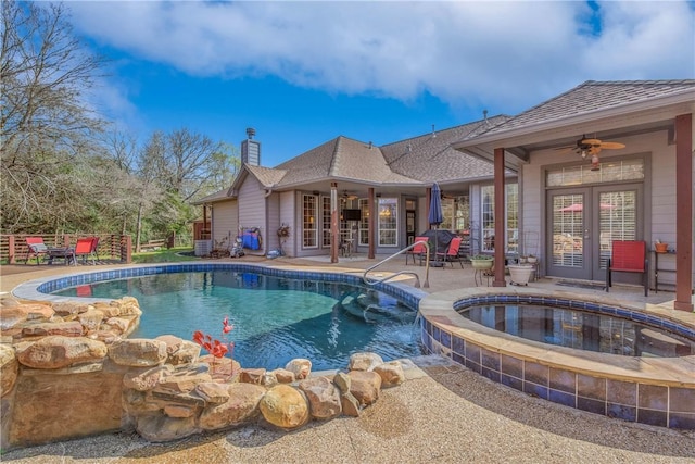 outdoor pool featuring a patio area, an in ground hot tub, french doors, and ceiling fan