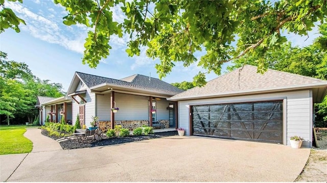 view of front of house with stone siding and an attached garage