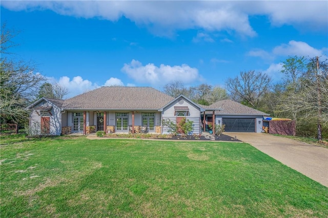 ranch-style house featuring an attached garage, french doors, concrete driveway, and a front lawn