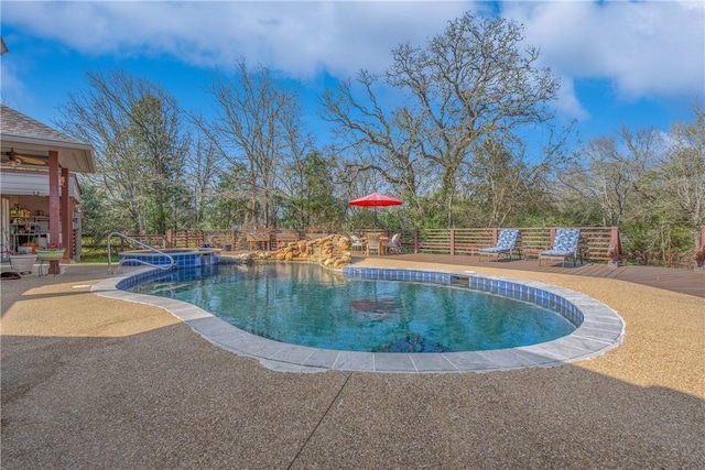 view of swimming pool featuring a patio area and a fenced in pool