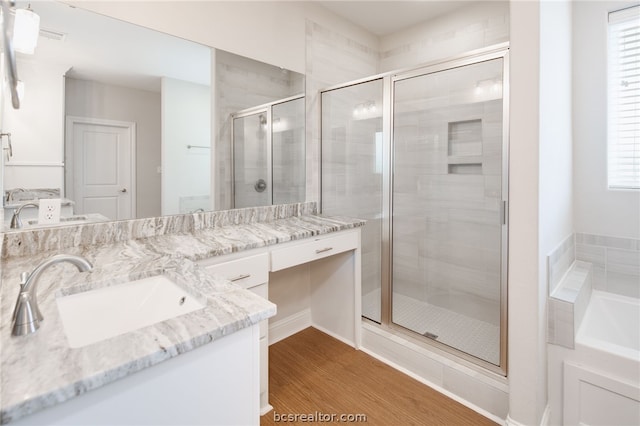 bathroom with vanity, hardwood / wood-style flooring, and an enclosed shower