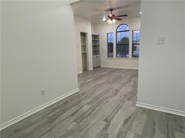 15933 Goliad Loop, Temple, TX 76502 - unfurnished room with ceiling fan, wood finished floors, and baseboards
