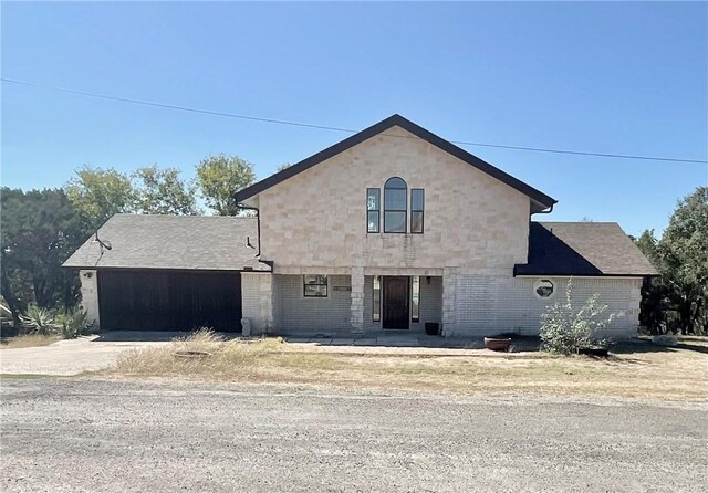 15933 Goliad Loop, Temple, TX 76502 - view of front of house featuring driveway and brick siding