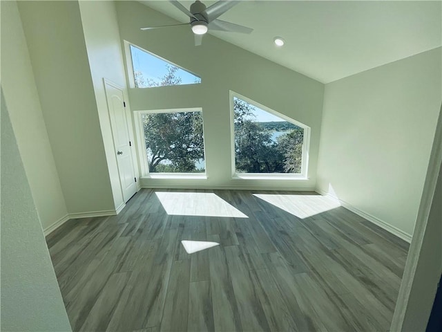 15933 Goliad Loop, Temple, TX 76502 - unfurnished room with a ceiling fan, baseboards, wood finished floors, recessed lighting, and a towering ceiling
