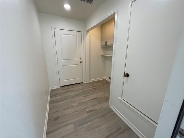 15933 Goliad Loop, Temple, TX 76502 - corridor featuring light wood-style flooring and baseboards