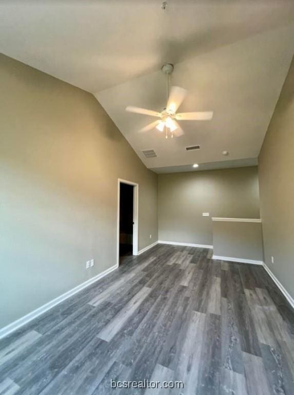 1305 W Villa Maria Rd Unit D107, Bryan, TX 77801 - empty room featuring a ceiling fan, dark wood-type flooring, baseboards, and vaulted ceiling