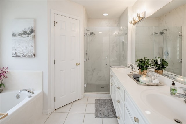 bathroom featuring tile patterned flooring, a sink, double vanity, and a shower stall